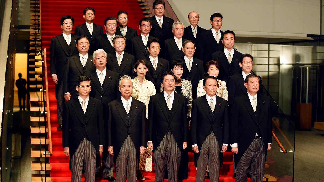 Japanese Prime Minister Shinzo Abe poses with members of his cabinet