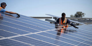 Workers at a solar panel facility in South Africa.
